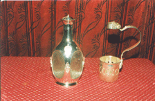 White Metal Decanter and Beer Bottle Holder.